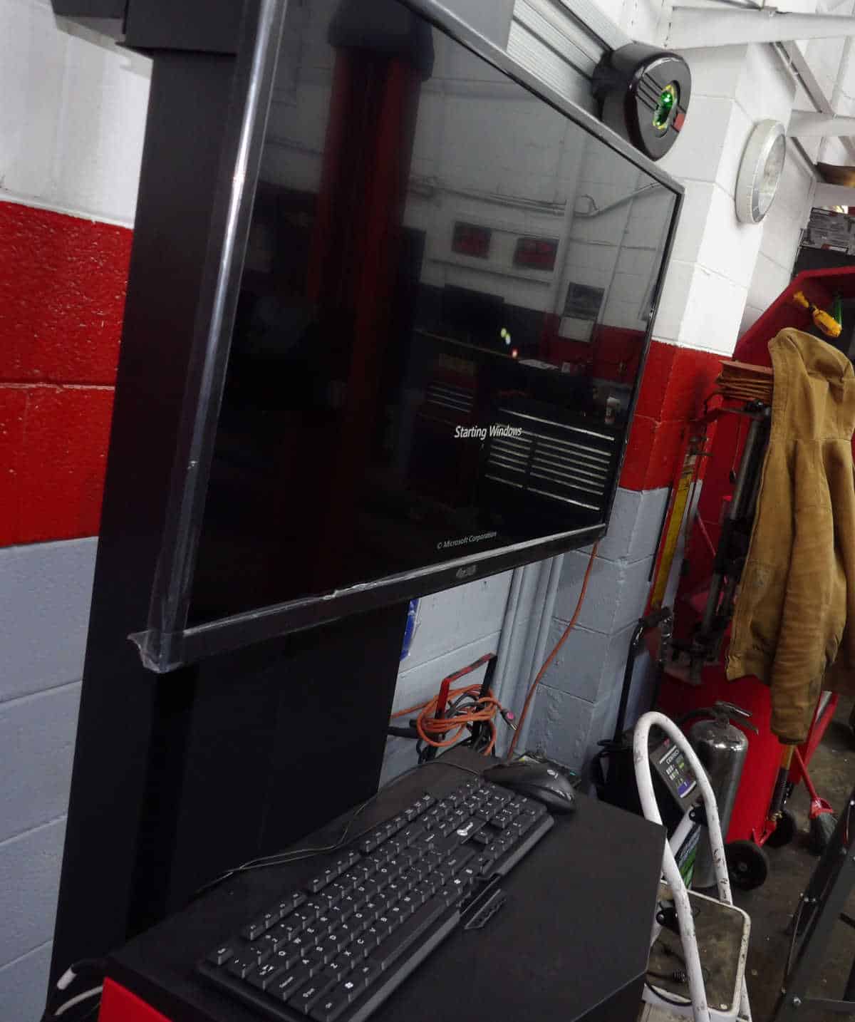Advanced Diagnostic Equipment at Pulaski Automotive Diagnostic computer setup with a large screen in the service area of Pulaski Automotive, showcasing modern tools for vehicle inspections and repairs in Chicago.