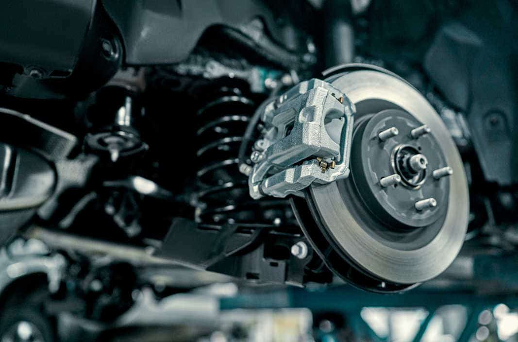 Close-Up of a Brake System During Repair Detailed view of a car's brake system and caliper during a professional brake repair service at Pulaski Automotive in Chicago